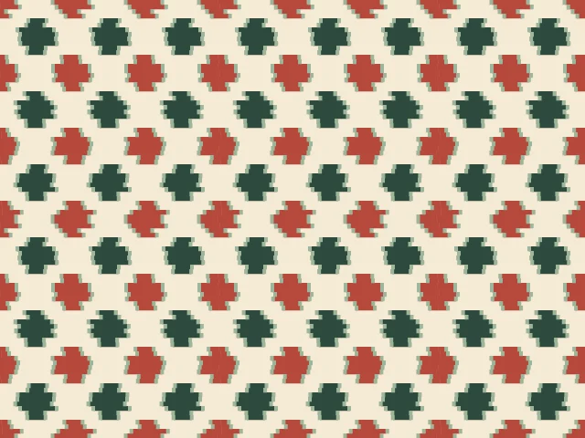 Small green and red ikat motifs on a cream ground