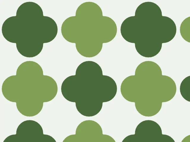 Four-lobed quatrefoil shapes alternating between dark and light green