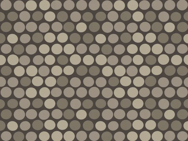 Round beige, tan and brown cobbles in staggered rows on a dark gray ground