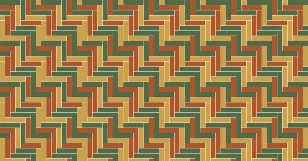 Herringbone parquet of green, rust and gold planks